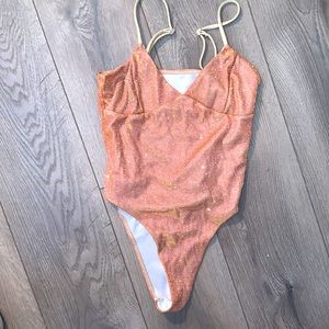 iridescent nude one piece